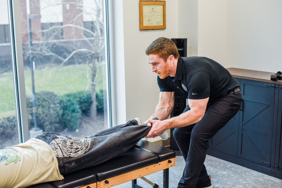 Dr. Joe McLeighton adjusting a patient