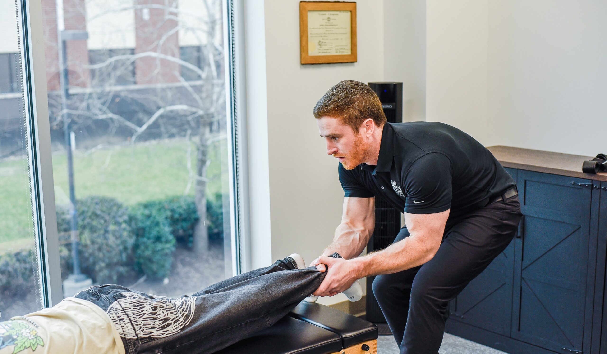 Dr. Joe McLeighton adjusting a patient's ankle at Inner Strength Chiropractic in Franklin, TN